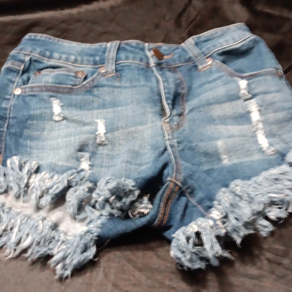 Elan, blue denim cut of shorts